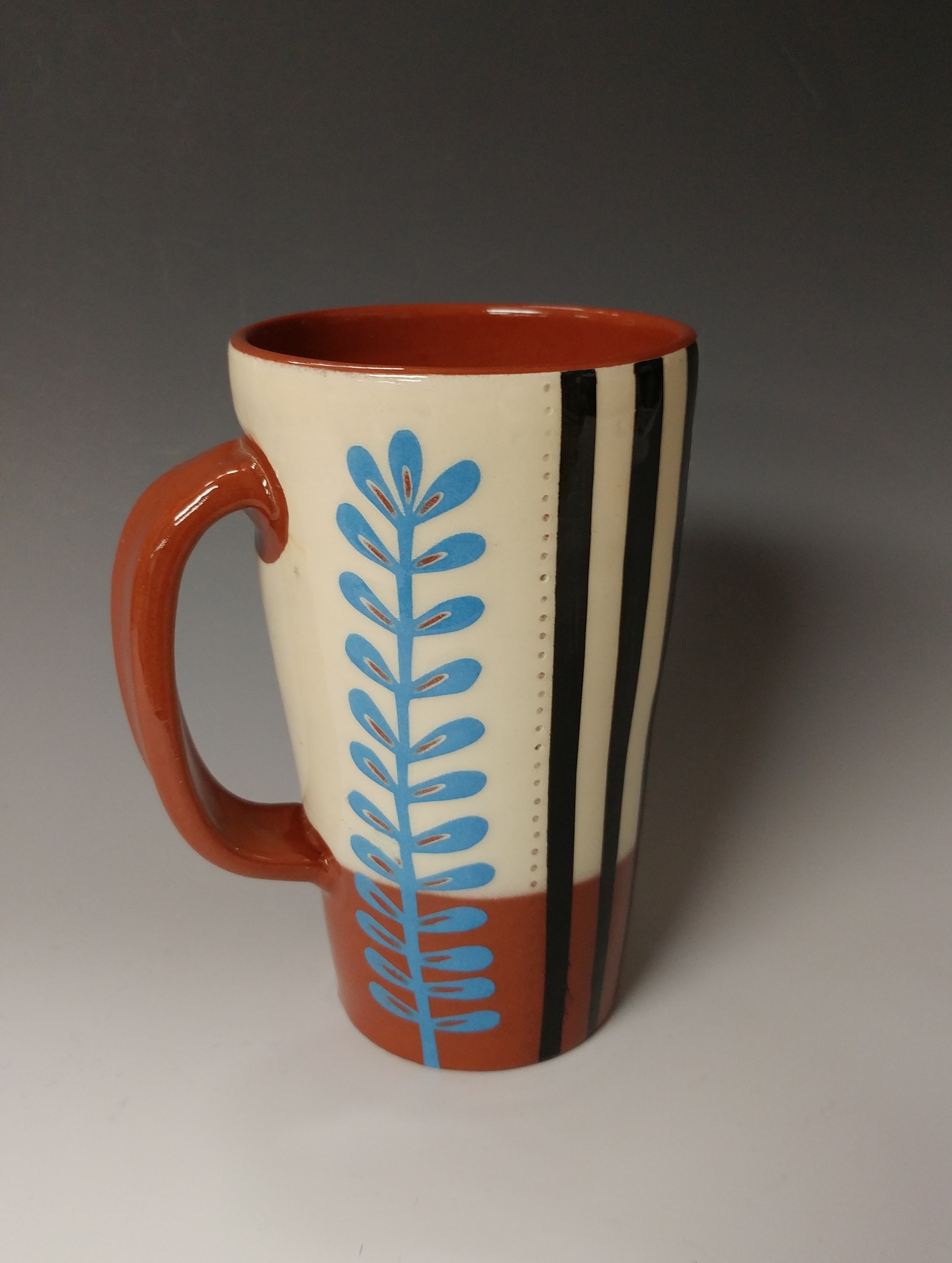 Tall Mug with Leafy Cutout and Stripes