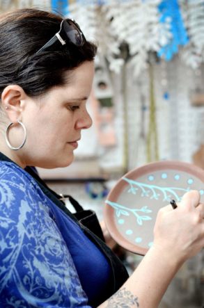 Rebecca May Verrill carving a plate