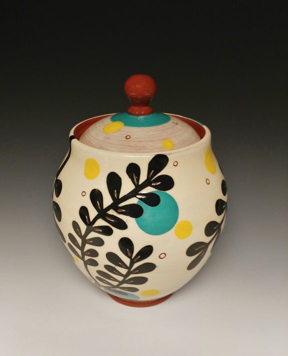 Leafy Lidded Jar with Black Cutouts and Yellow Dots