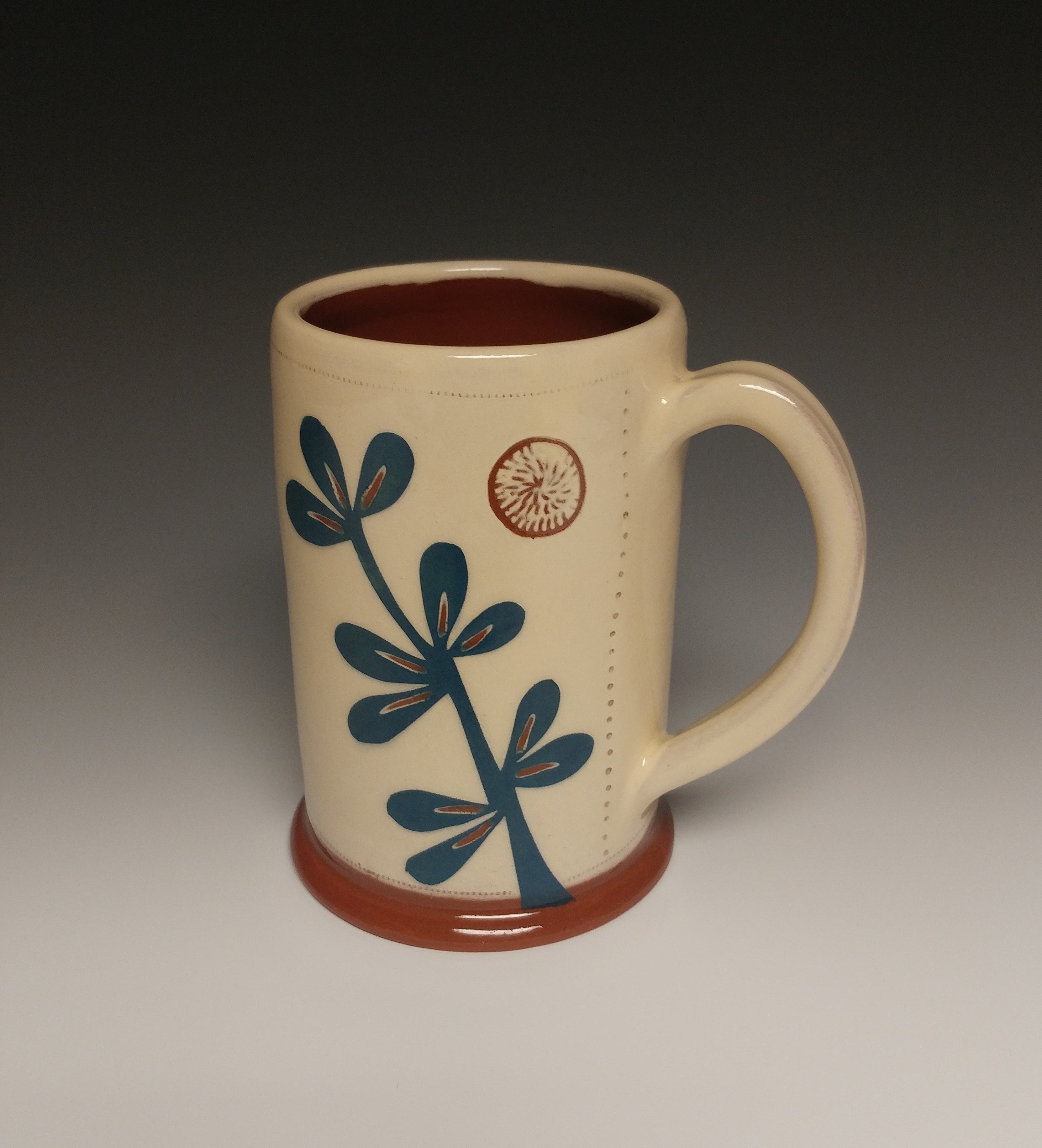 Leafy Mug with Blue Plant and Carved Orb