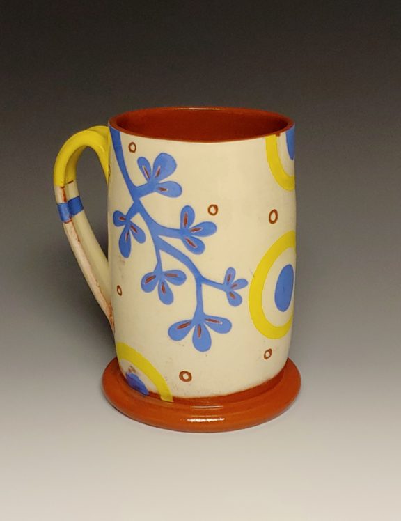 Cheerful Mug with Blue Branch Dots and Yellow Rings