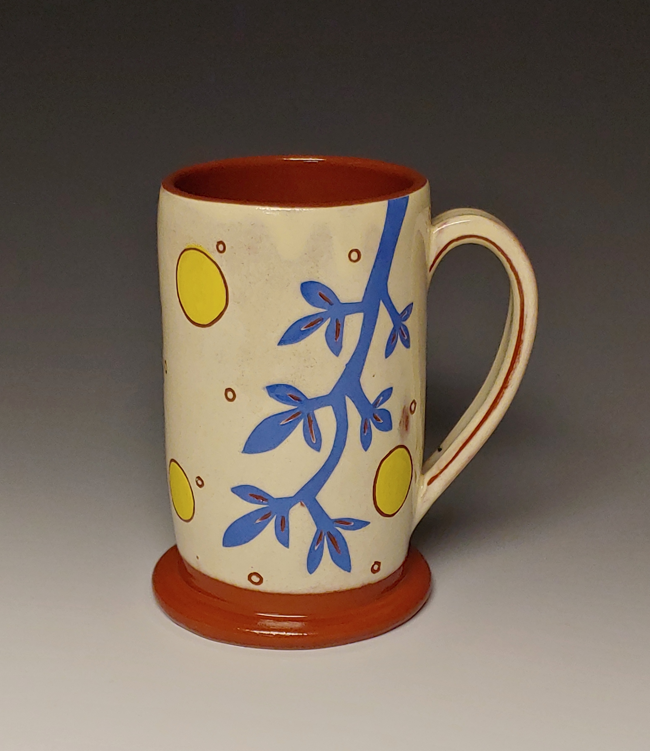 Cheerful Mug with Blue Branch and Yellow Spots
