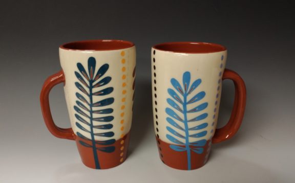 Two Tall Mugs with Leafy Cutouts and Dots