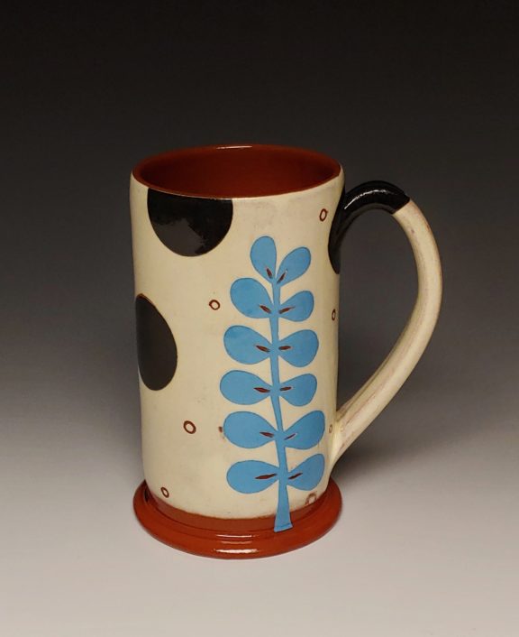 Cheerful Mug with Turquoise Leaf and Black Spots