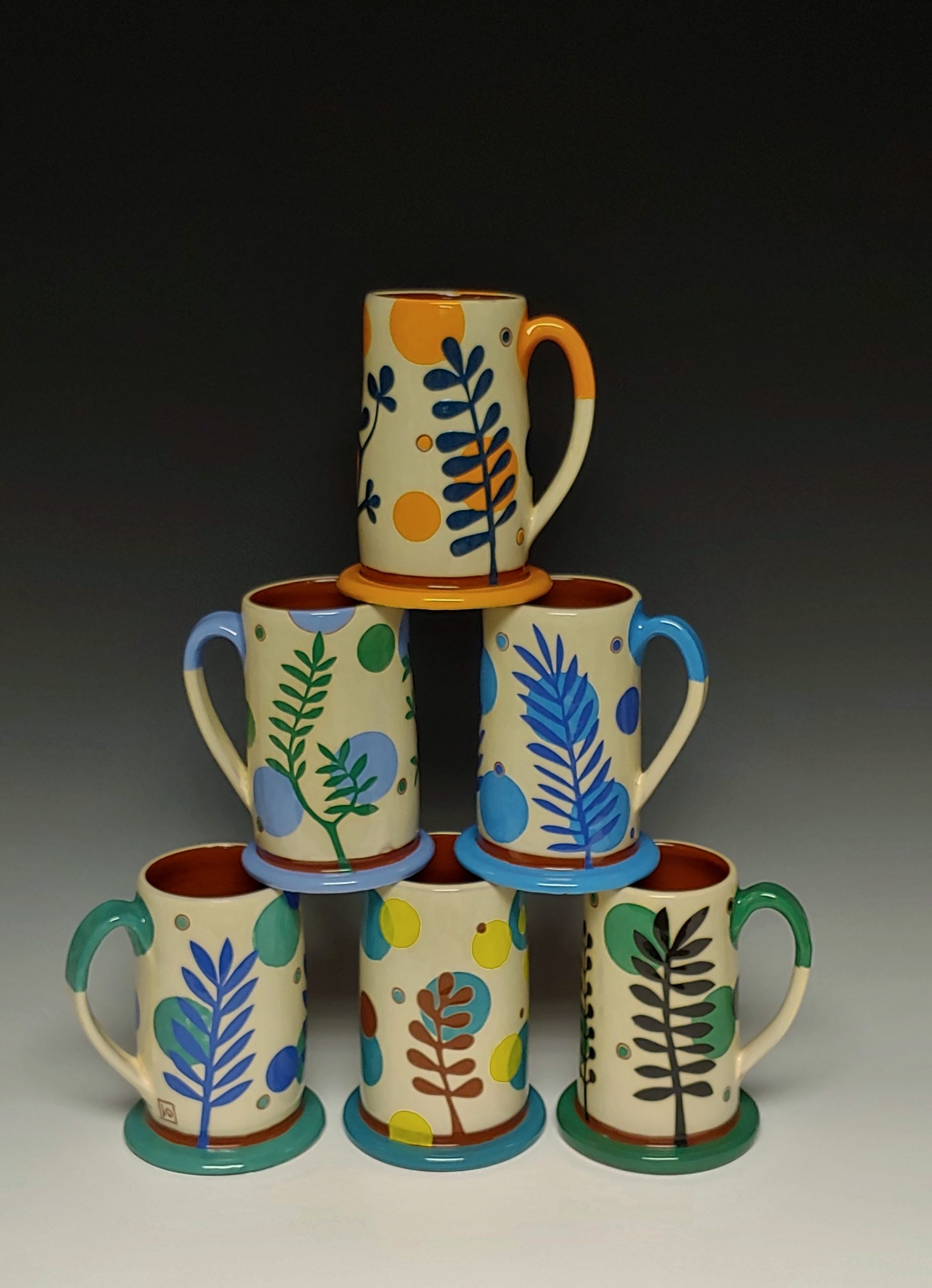 Six Stacked Colorful mugs